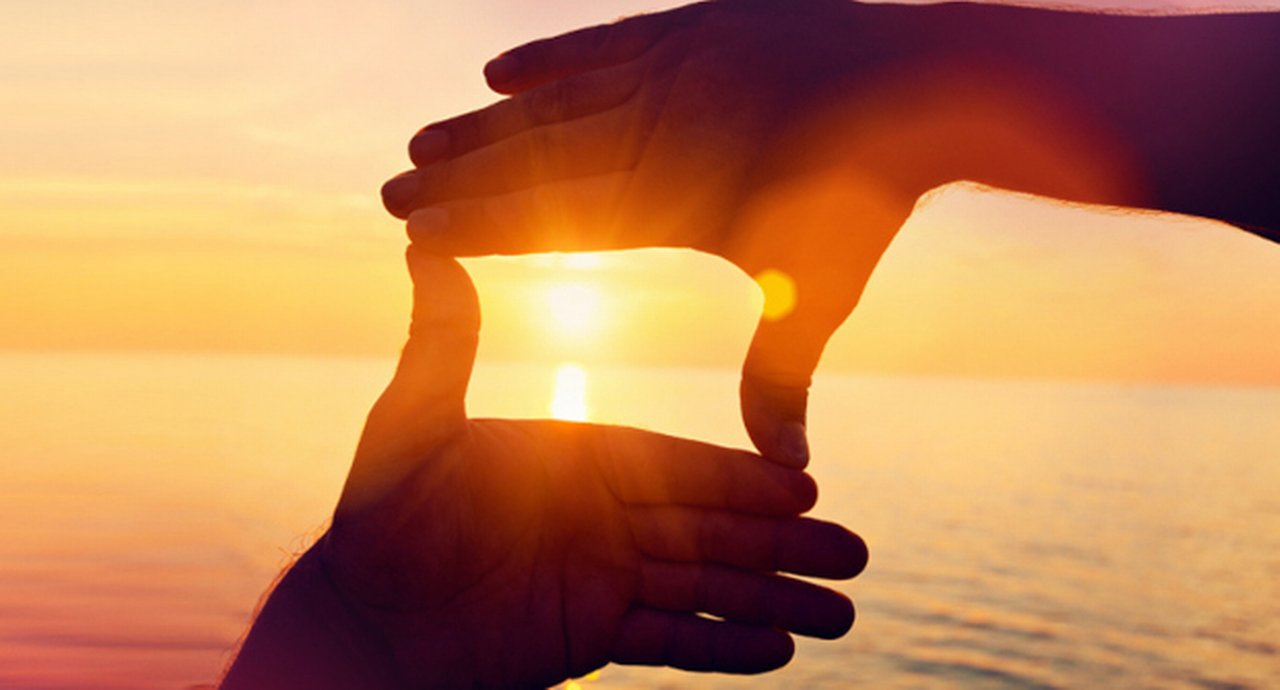 Giving a helping hand on the background of the dawn