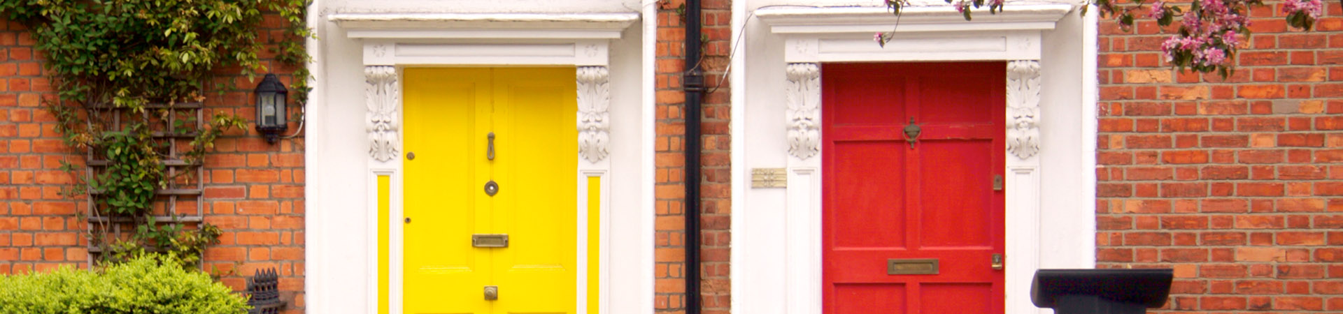 Typical Terraced Houses With Small Front Garden And Colourful Doors Yellow And Red Dublin Ireland